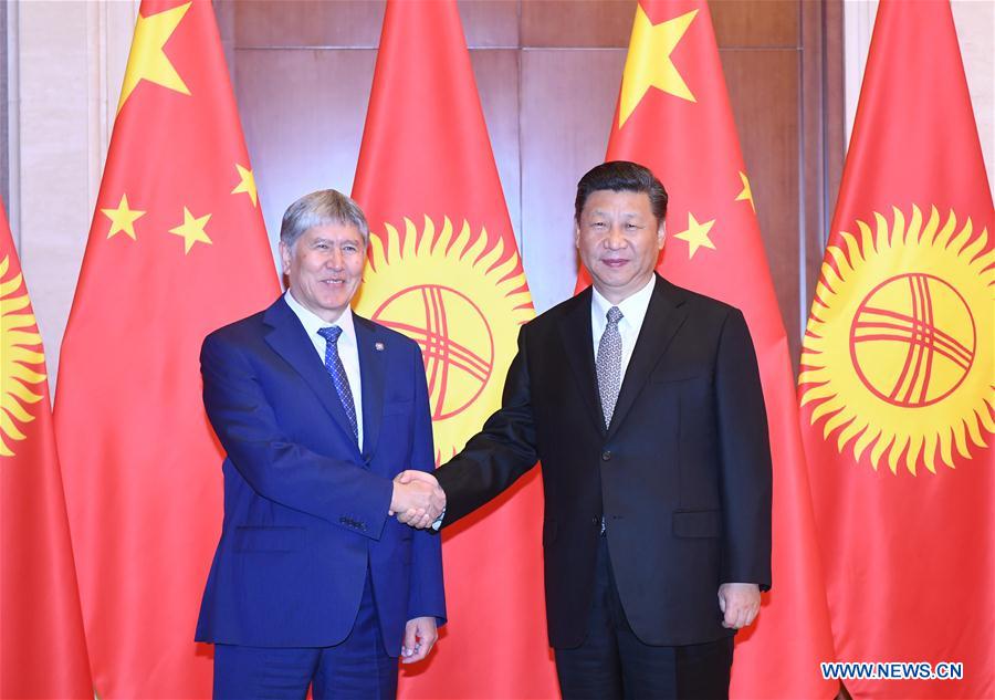 Chinese President Xi Jinping (R) meets with Kyrgyzstan's President Almazbek Atambayev in Beijing, capital of China, May 16, 2017. Almazbek Atambayev was in Beijing to attend the two-day Belt and Road Forum for International Cooperation, which ended on Monday.[Photo: Xinhua]
