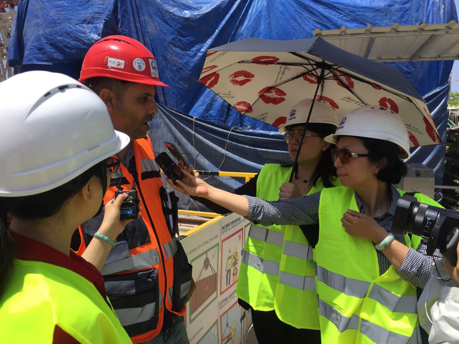 An Israeli worker receives interview from CRI reporters. [Photo: China Plus]