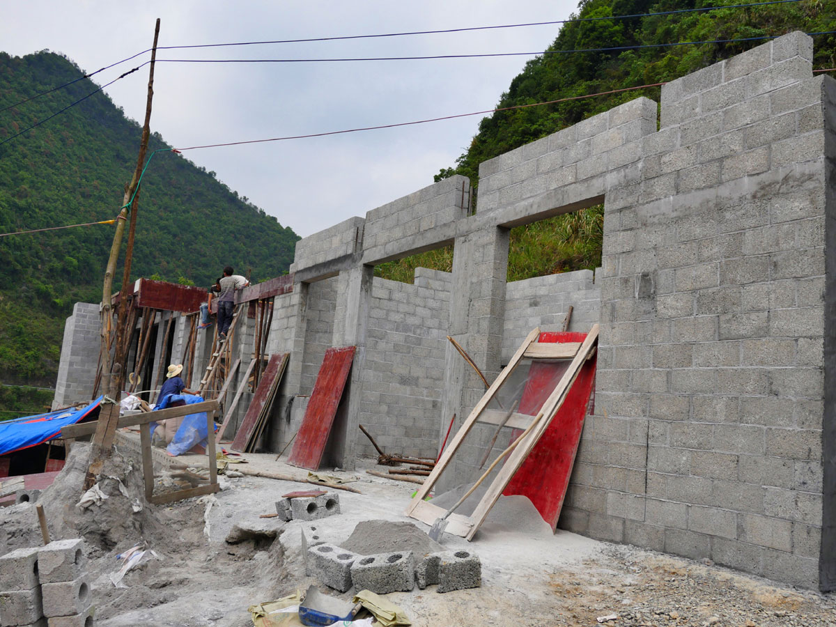 A new house under construction in Baohao village in a mountainous area of the Guangxi Zhuang Autonomous Region in southwest China.[Photo:China Plus/Wang Xin]