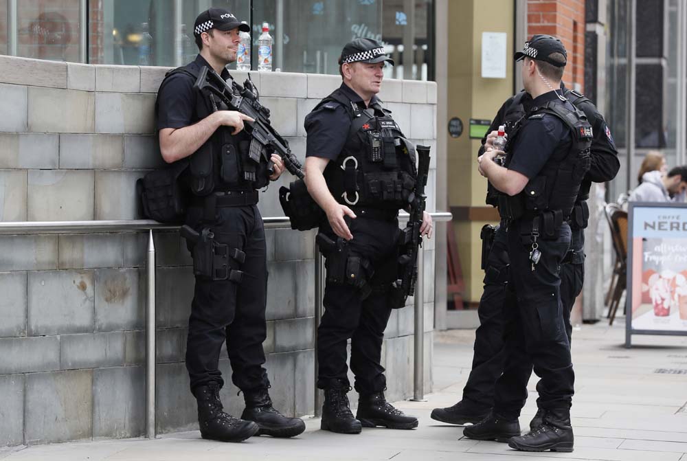 Armed police officers keep guard near the Arndale centre in Manchester, Wednesday, May 24, 2017. [Photo: AP/Kirsty Wigglesworth]
