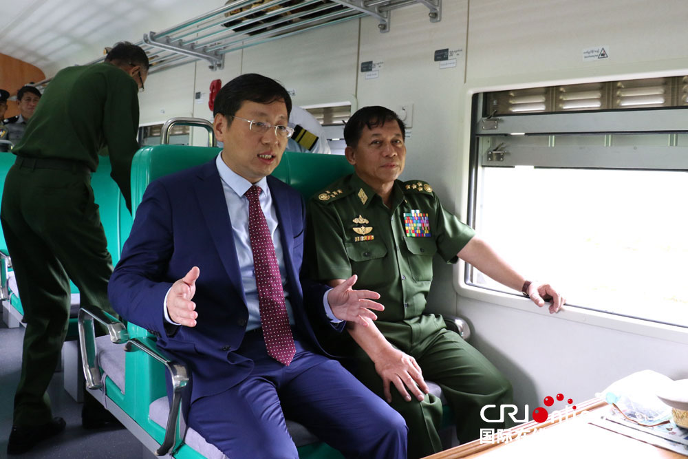 Senior General Min Aung Hlaing tries out the train donated by China to Myanmar accompanied by the Chinese ambassador Hong Liang, in Naypyidaw, Myanmar, on May 26, 2017. [Photo: CRI Online]