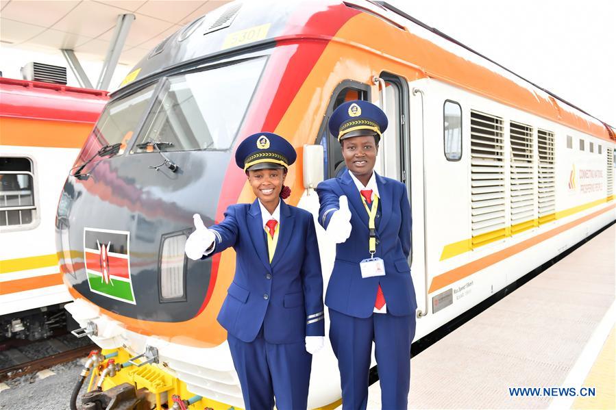 Two female engine drivers gesture before the operations of the Standard Gauge Railway (SGR) in Mombasa, Kenya, on May 31, 2017. Kenya began operations on the Chinese-built Standard Gauge Railway (SGR) Wednesday. [Photo: Xinhua]