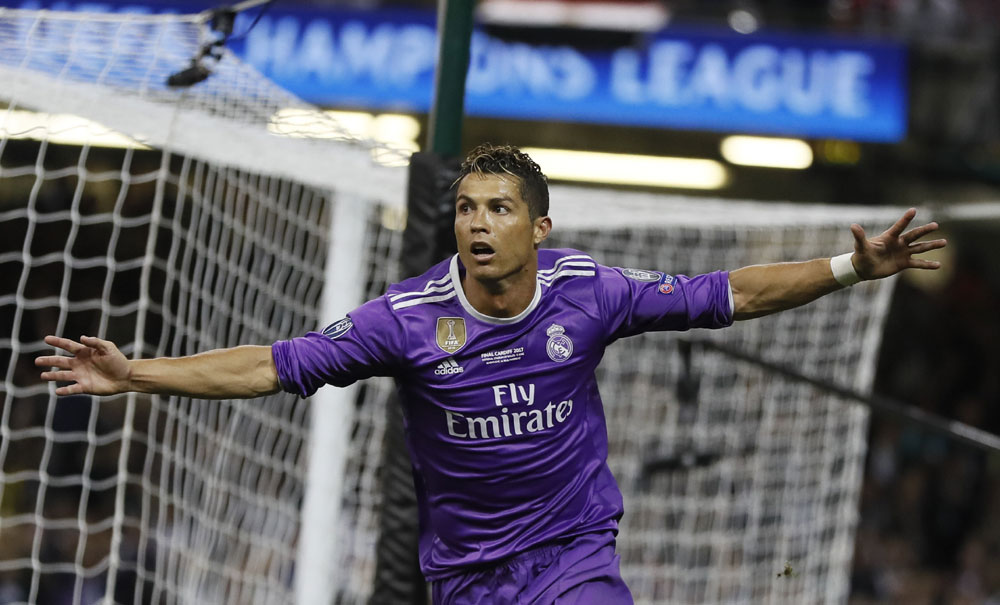 Real Madrid's Cristiano Ronaldo celebrates after scoring during the Champions League final soccer match between Juventus and Real Madrid at the Millennium Stadium in Cardiff, Wales, Saturday June 3, 2017. [Photo:AP Photo/Kirsty Wigglesworth]