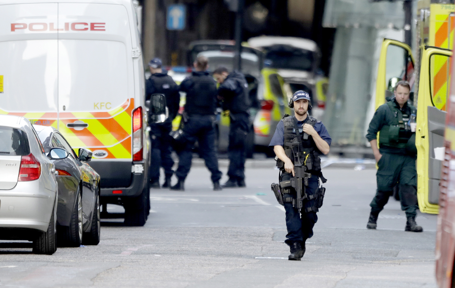 An armed British police officer walks within a cordoned off area after an attack in the London Bridge area of London, June 4, 2017. Terrorism struck at the heart of London, police said Sunday, after a vehicle veered off the road and mowed down pedestrians on London Bridge and witnesses told of men with large knives stabbing passersby at nearby Borough Market. [Photo: AP/Matt Dunham]