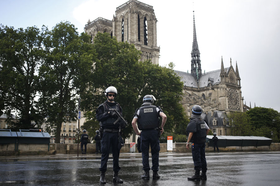 Police officers seal off the access to Notre Dame cathedral in Paris, France, Tuesday, June 6, 2017. Paris police say an unidentified assailant has attacked a police officer near the Notre Dame Cathedral, and the officer then shot and wounded the attacker. [Photo: AP/Matthieu Alexandre]