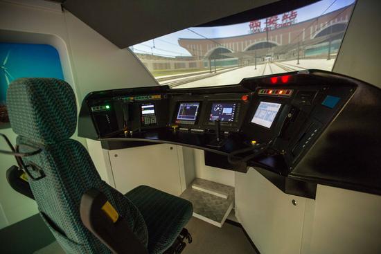 Simulated high-speed train driving cab in the Chinese pavilion at the World Expo in the Kazakh capital, Astana [Photo: Xinhua]