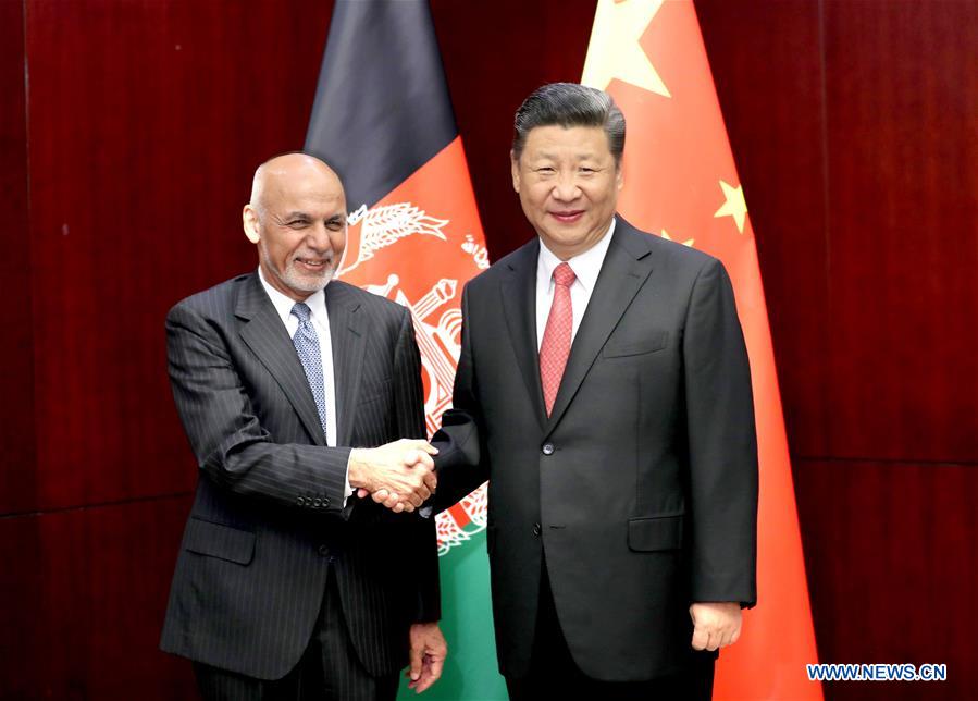 Chinese President Xi Jinping (R) meets with his Afghan counterpart Mohammad Ashraf Ghani in Astana, capital of Kazakhstan, June 8, 2017. [Photo: Xinhua/Ding Lin]