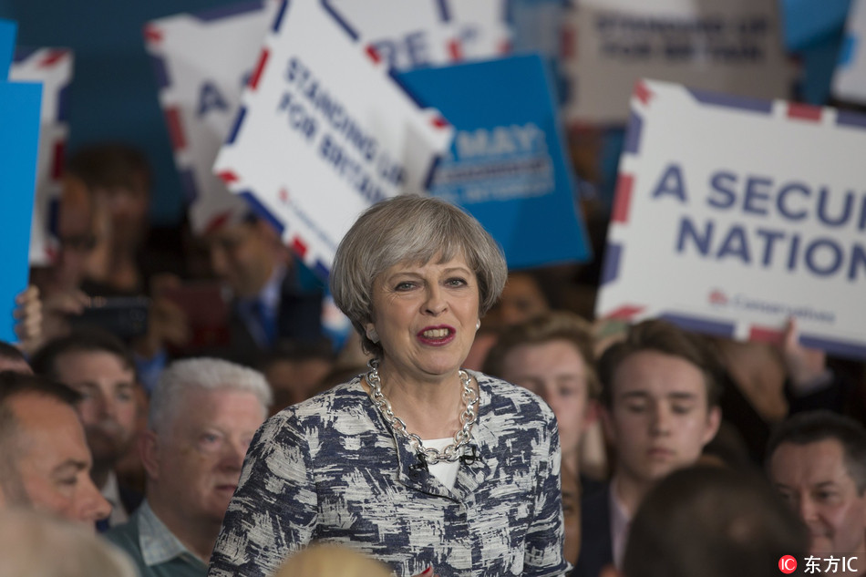 British Prime Minister and leader of the British Conservative Party Theresa May speaks to supporters at a Conservative campaign event for the British General Election, at the National Conference Centre in Birmingham, central England, June 7, 2017. [Photo: IC]