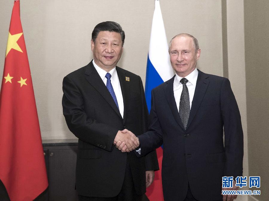 Chinese President Xi Jinping and his Russian counterpart, Vladimir Putin, meet in Astana on June 8, 2017. [Photo: Xinhua]