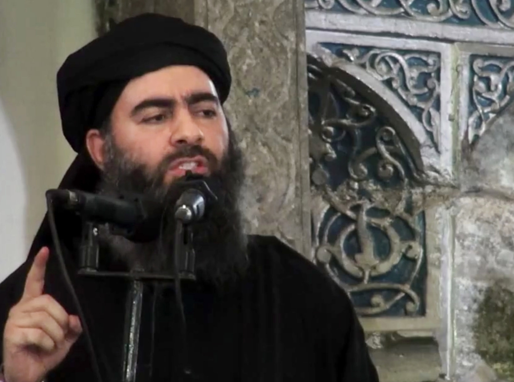 The leader of the Islamic State group, Abu Bakr al-Baghdadi, delivers a sermon at a mosque in Iraq during his first public appearance, July 5, 2014. [Photo: AP]