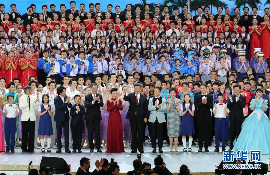 Chinese President Xi Jinping (C, front), also general secretary of the Central Committee of the Communist Party of China and chairman of the Central Military Commission, steps onto the stage and sings in chorus the song "Ode to the Motherland" with the performers and the audience during a grand gala marking the 20th anniversary of Hong Kong's return to China at Hong Kong Convention and Exhibition Center, in Hong Kong, south China, June 30, 2017. [Photo: Xinhua]