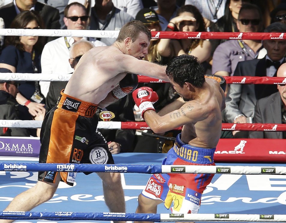 Jeff Horn, left, of Australia and Manny Pacquiao of the Philippines fight during their WBO World welterweight title bout in Brisbane, Australia, Sunday, July 2, 2017. [Photo: AP/Tertius Pickard]