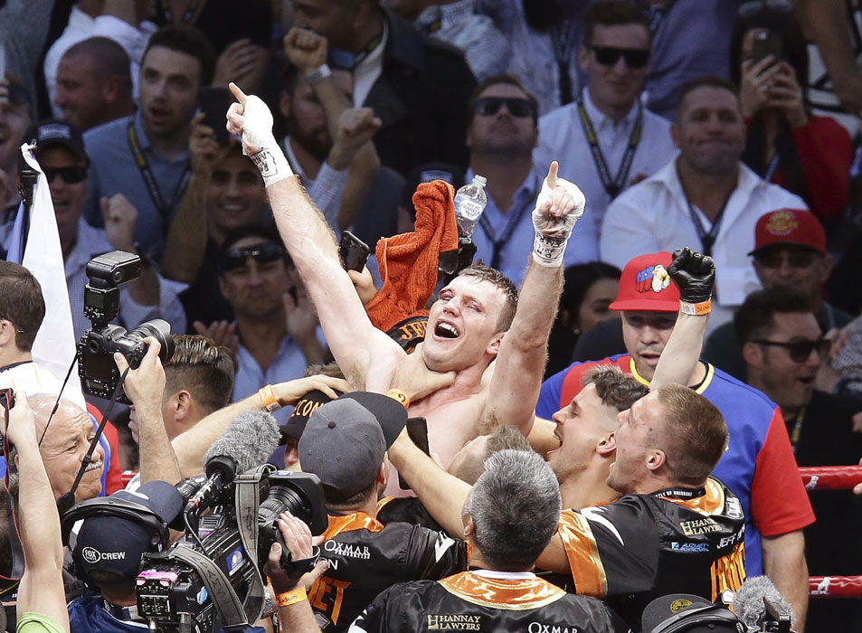 Jeff Horn of Australia celebrates after beating Manny Pacquiao of the Philippines during their WBO World Welterweight title fight in Brisbane, Australia, Sunday, July 2, 2017. [Photo: AP/Tertius Pickard]