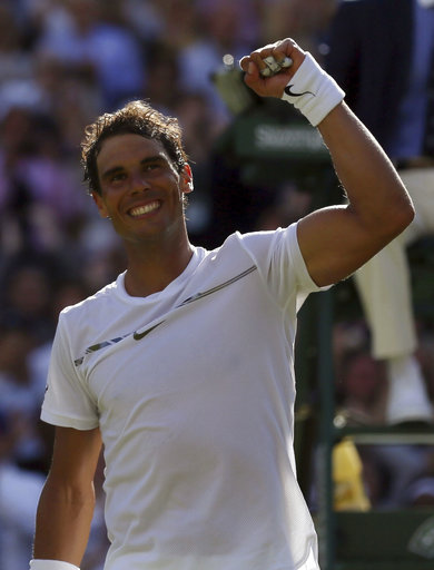 Spain's Rafael Nadal celebrates after winning his Men's Singles Match against Australia's John Millman on the opening day at the Wimbledon Tennis Championships in London Monday, July 3, 2017. [Photo: AP/Tim Ireland]
