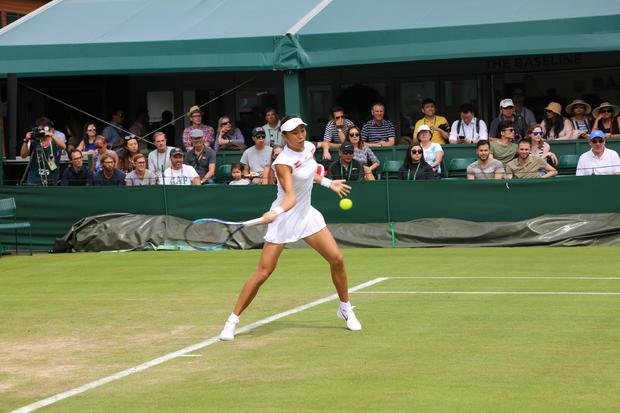 Zhang Shuai of China in action against Viktorija Golubic from Switzerland at the Wimbledon Championships. [Photo: eastday.com]