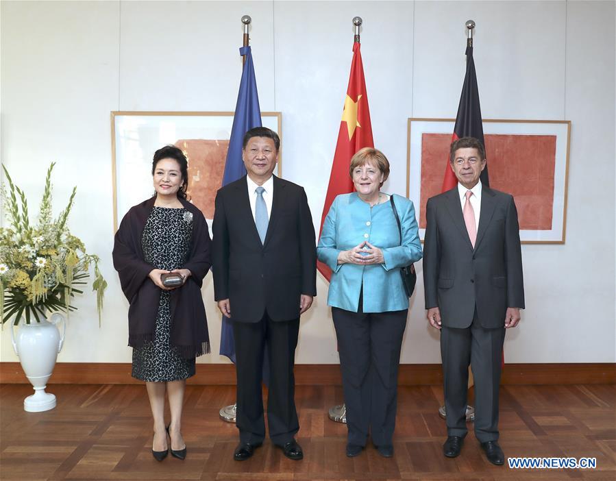 Chinese President Xi Jinping (2nd L) and his wife Peng Liyuan (1st L) are greeted by German Chancellor Angela Merkel (2nd R) and her husband Joachim Sauer (1st R) at the Max Liebermann Haus (Max Liebermann House) nearby Brandenburg Gate in Berlin, Germany, July 4, 2017. [Photo: Xinhua/Ma Zhancheng]