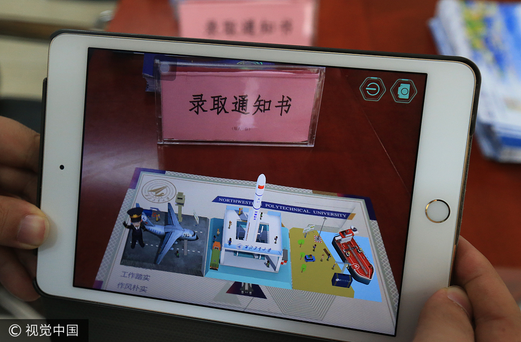 Scans of QR codes on the back of NWPU's admission notice give students access to a dynamic presentation of the university's characteristics. [Photo: VCG]