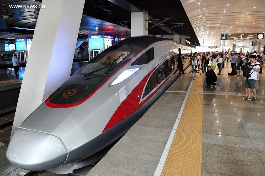 Photo taken on June 26, 2017 shows the China's new bullet train "Fuxing" at Beijing South Railway Station in Beijing, capital of China. China's next generation bullet train "Fuxing" debuted on the Beijing-Shanghai line on Monday. A CR400AF model departed Beijing South Railway Station at 11:05 a.m. for Shanghai. At the same time, the CR400BF model left Shanghai Hongqiao Railway Station for Beijing. The new bullet trains, also known as electric multiple units (EMU), boast top speeds of 400 kilometers an hour and a consistent speed of 350 kilometers an hour.