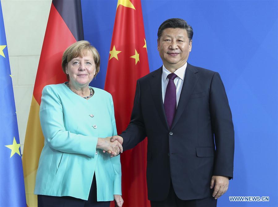 Chinese President Xi Jinping (R) holds talks with German Chancellor Angela Merkel in Berlin, capital of Germany, July 5, 2017. [Photo: Xinhua/Xie Huanchi]