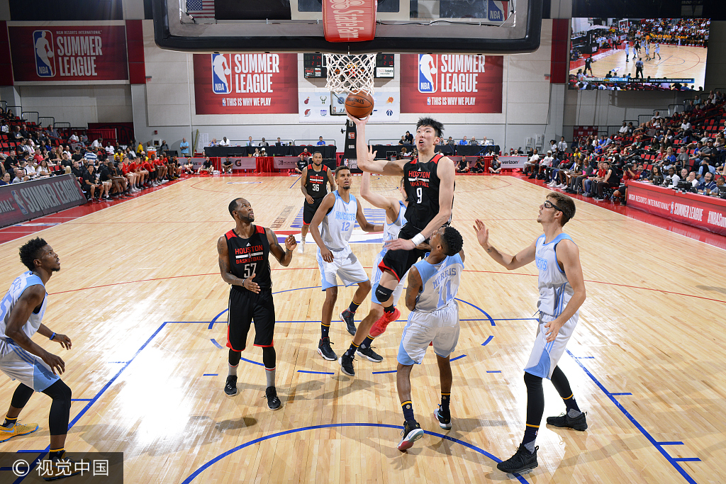 Zhou Qi #9 of the Houston Rockets shoots the ball during the game against the Denver Nuggets during the 2017 Las Vegas Summer League on July 7, 2017 at the Cox Pavilion in Las Vegas, Nevada. [Photo: NBAE via Getty Images/David Dow]