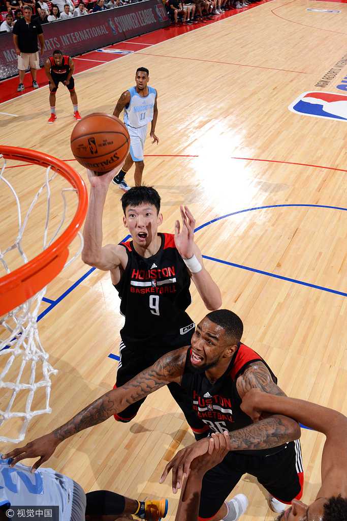 Zhou Qi #9 of the Houston Rockets shoots the ball during the game against the Denver Nuggets during the 2017 Las Vegas Summer League on July 7, 2017 at the Cox Pavilion in Las Vegas, Nevada. [Photo: NBAE via Getty Images/David Dow]