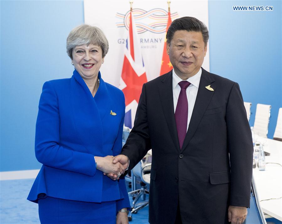 Chinese President Xi Jinping meets with British Prime Minister Theresa May in Hamburg, Germany, July 7, 2017. [Photo: Xinhua/Li Xueren]