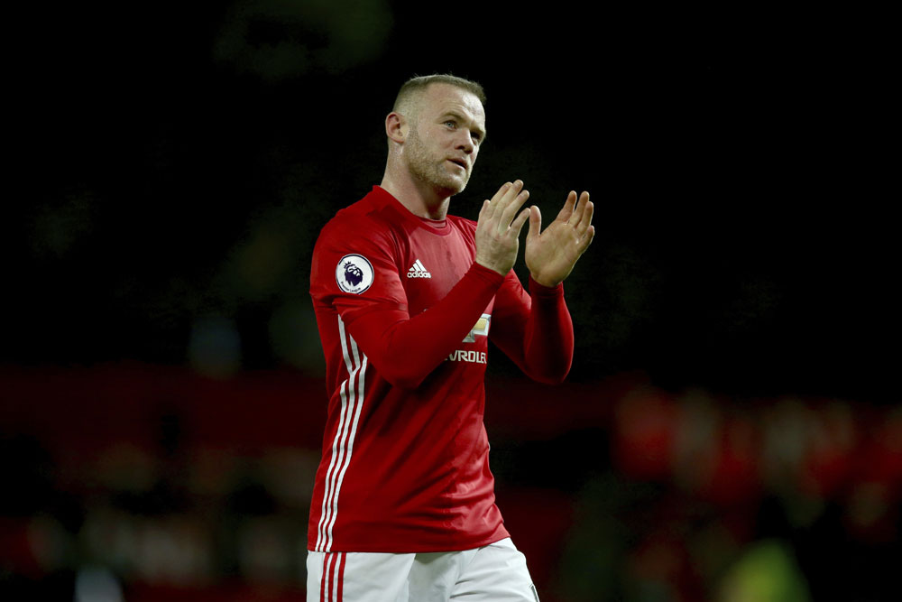 In this Sunday, Jan. 15, 2017 file photo, Manchester United's Wayne Rooney leaves the field after the English Premier League soccer match between Manchester United and Liverpool at Old Trafford stadium in Manchester, England. Wayne Rooney has left Manchester United to rejoin Everton after 13 years at Old Trafford, it was announced on Sunday, July 9, 2017. Everton says Rooney signed a two-year contract. [Photo: AP/Dave Thompson]