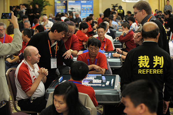 Mahjong players compete at 3rd World Mahjong Championship. [Photo: VCG]