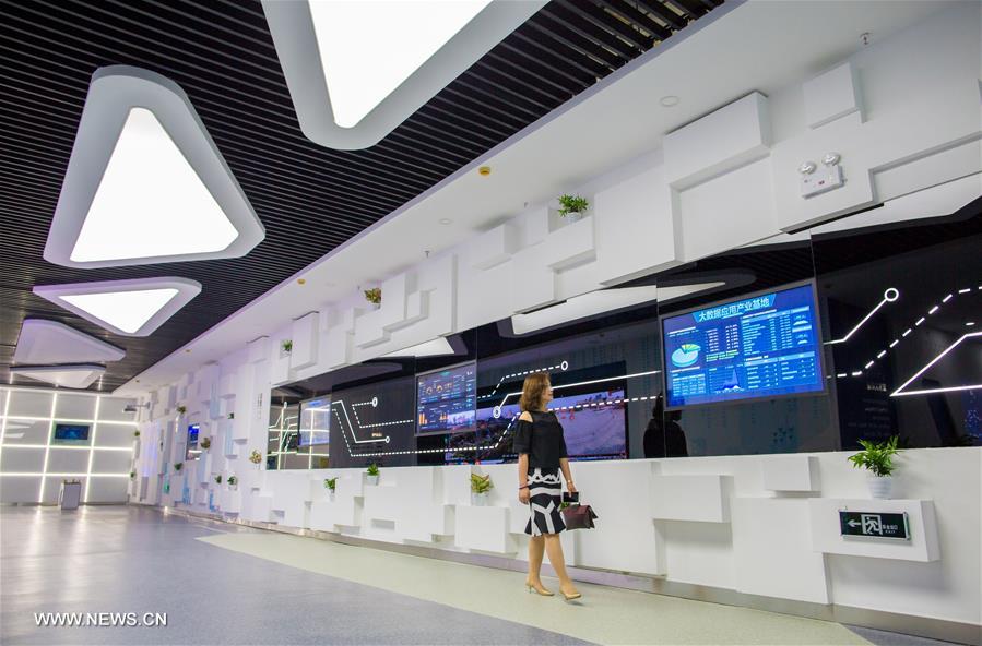 A woman visits the Isoftstone big data industry center in Yuquan District of Hohhot, capital of north China's Inner Mongolia Autonomous Region, Aug. 1, 2017. Isoftstone big data industry center was put into operation on Tuesday in Yuquan District to promote the construction of "Smart City" and "Smart tourism". [Photo: Xinhua]