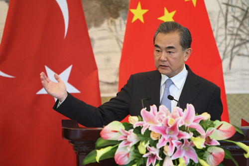 Chinese Foreign Minister Wang Yi speaks at a news conference Sunday.[Photo:fmprc.gov.cn]