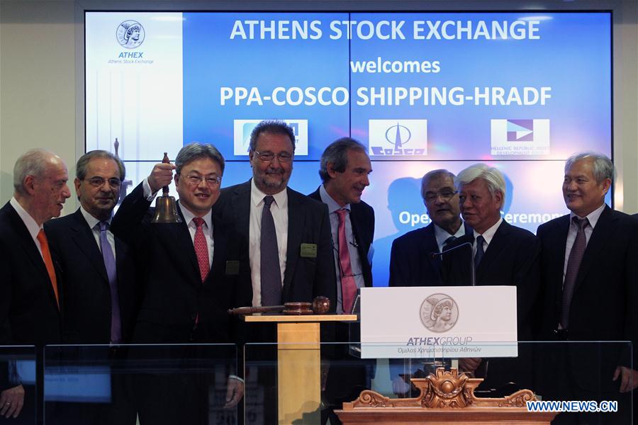 President of Cosco Shipping Wan Min (3rd L) rings the bell at the opening session, marking the debut at Greece's largest port at the Athens Stock Exchange in Athens, Greece, Aug. 10, 2016.[Photo: Xinhua]