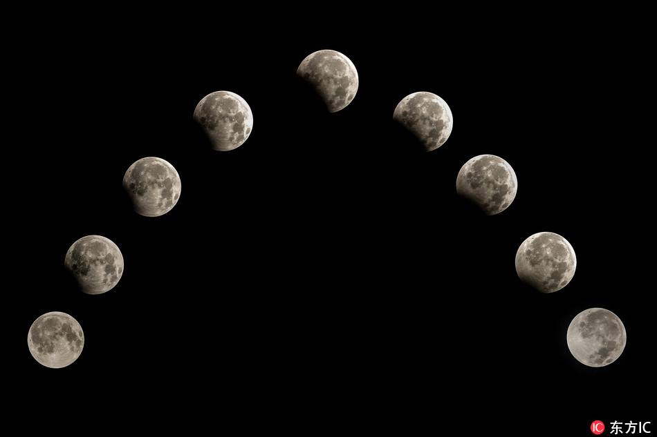 全球多地现月偏食 Partial lunar eclipse seen around the world