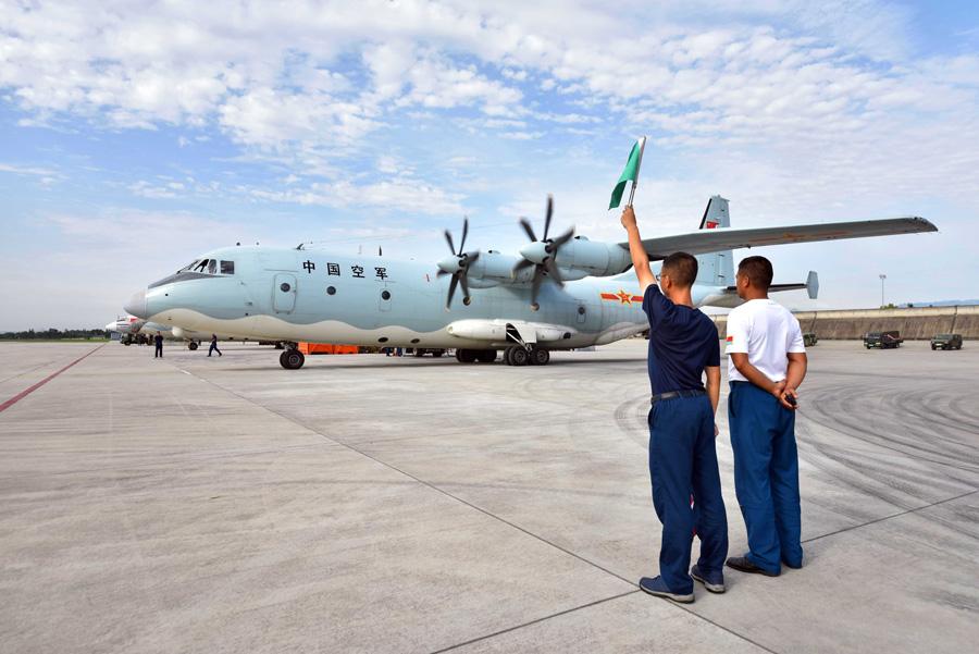 A military transport plane Y-9 prepares to take off for an aerial photography mission over the earthquake-hit region in Southwest China's Sichuan Province on Aug. 9, 2017. [Photo provided to chinadaily.com.cn]