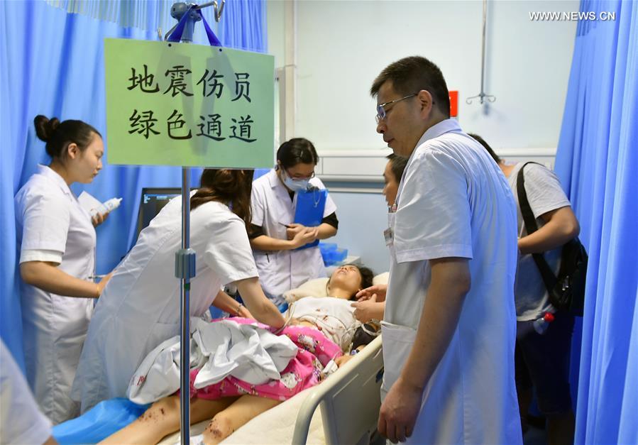A woman injured in Jiuzhaigou earthquake receives medical treatment in the Central Hospital of Mianyang City, southwest China's Sichuan Province, Aug. 9, 2017. [Photo: Xinhua]