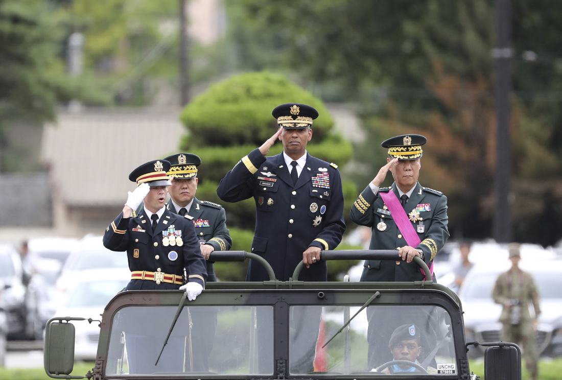 U.S. Gen. Vincent Brooks, commander of Combined Forces Command, center, salutes with incoming Deputy Commander Gen. Kim Byung-joo, left rear, and outgoing Deputy Commander Gen. Leem Ho-young, right, in a car, as they inspect honor guards during a change of command and change of responsibility ceremony for Deputy Commander of the South Korea-U.S. Combined Force Command at Yongsan Garrison, a U.S. military base, in Seoul, South Korea, Friday, Aug. 11, 2017. U.S. and South Korean military officials plan to move ahead with large-scale exercises later this month that North Korea, now finalizing plans to launch a salvo of missiles toward Guam, claims are a rehearsal for war. [Photo: AP/Lee Jin-man]