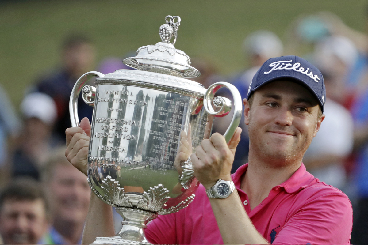 Justin Thomas poses with the Wanamaker Trophy after winning the PGA Championship golf tournament at the Quail Hollow Club Sunday, Aug. 13, 2017, in Charlotte, N.C. [Photo: AP]