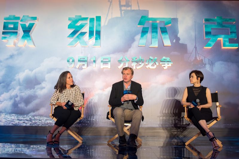 Emma Thomas (left), producer of "Dunkirk," along with her director husband, Christopher Nolan, (center) attend a news conference to promote their new film in Beijing on Monday, August 21, 2017. [Photo: China Plus]